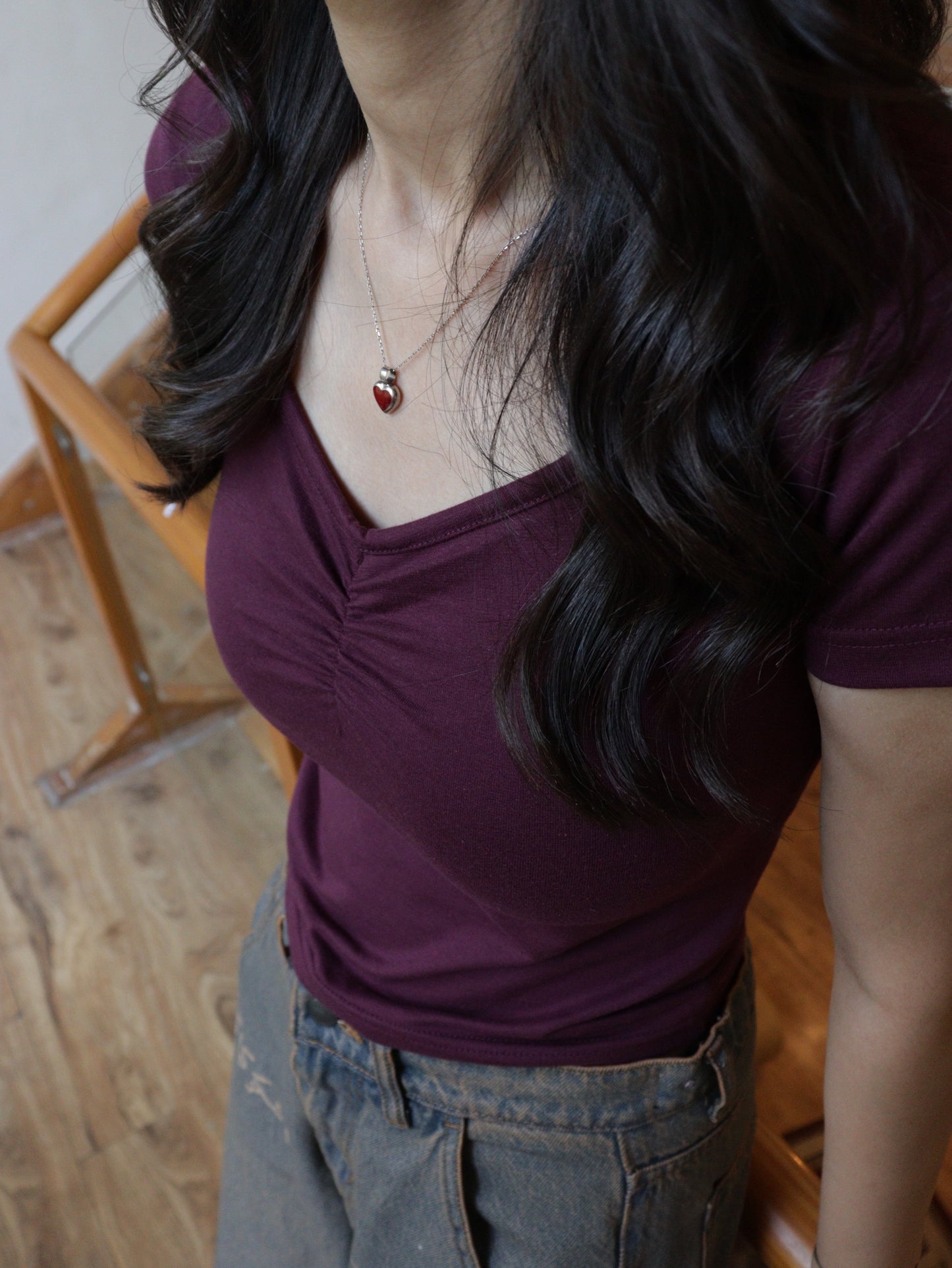 clinched maroon baby tee