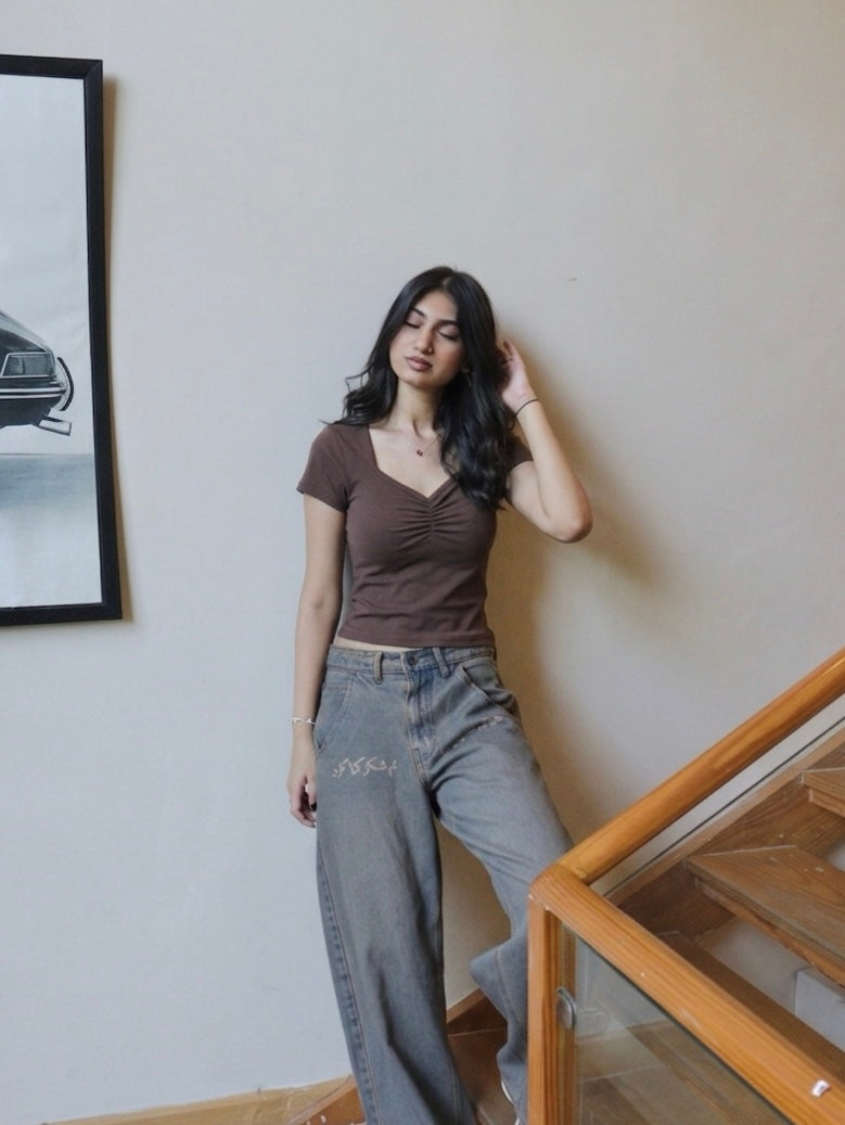 clinched brown baby tee